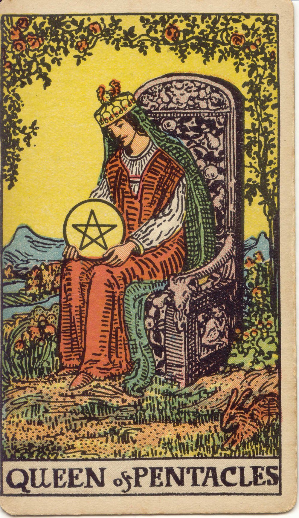 The Queen of Pentacles from the Rider-Waite-Smith tarot deck: a nurturing queen sits on a stone throne in a garden holding a golden pentacle, a rabbit at her feet and roses around her.