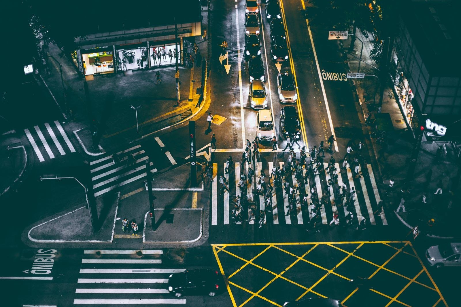 Crowds on a city street at night.