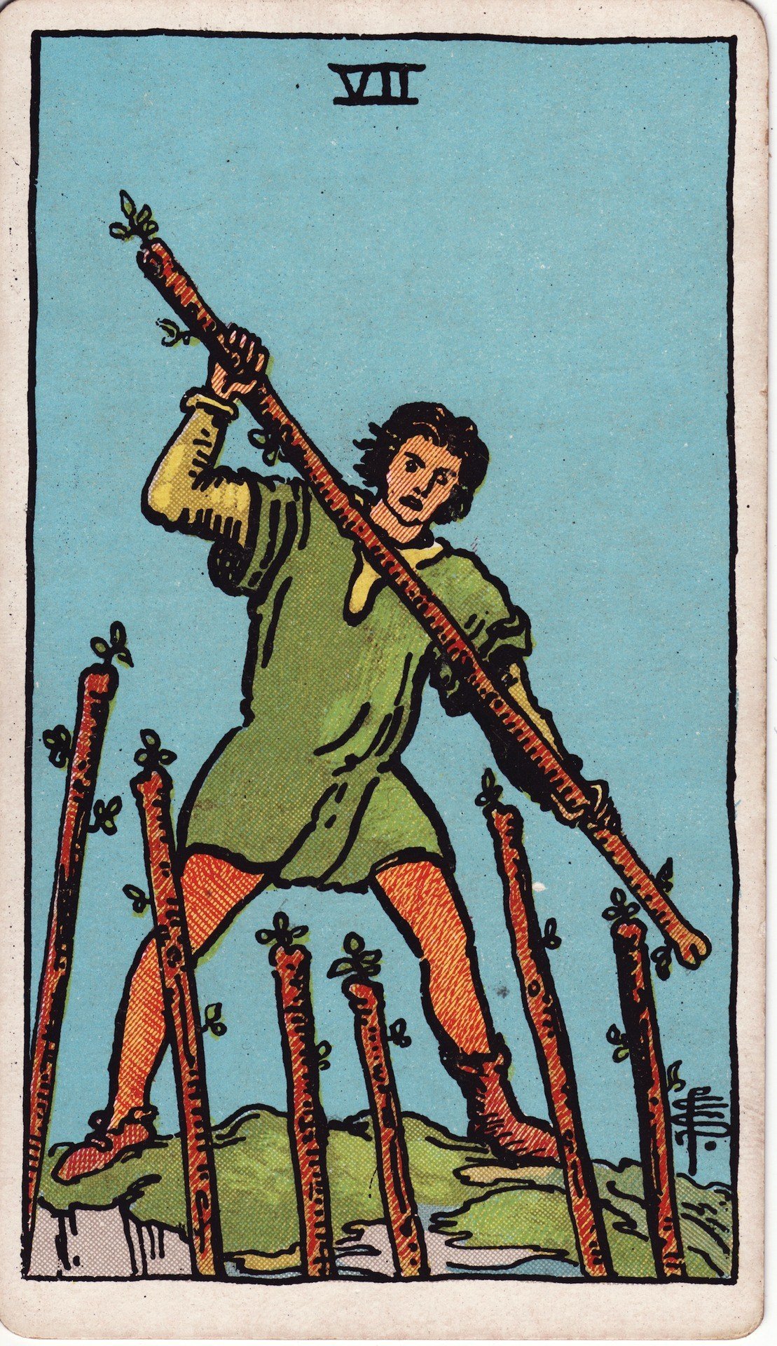 The Seven of Wands from the Rider-Waite-Smith tarot deck: a young man stands on a rocky hilltop brandishing a wand, fending off six wands rising toward him from below.