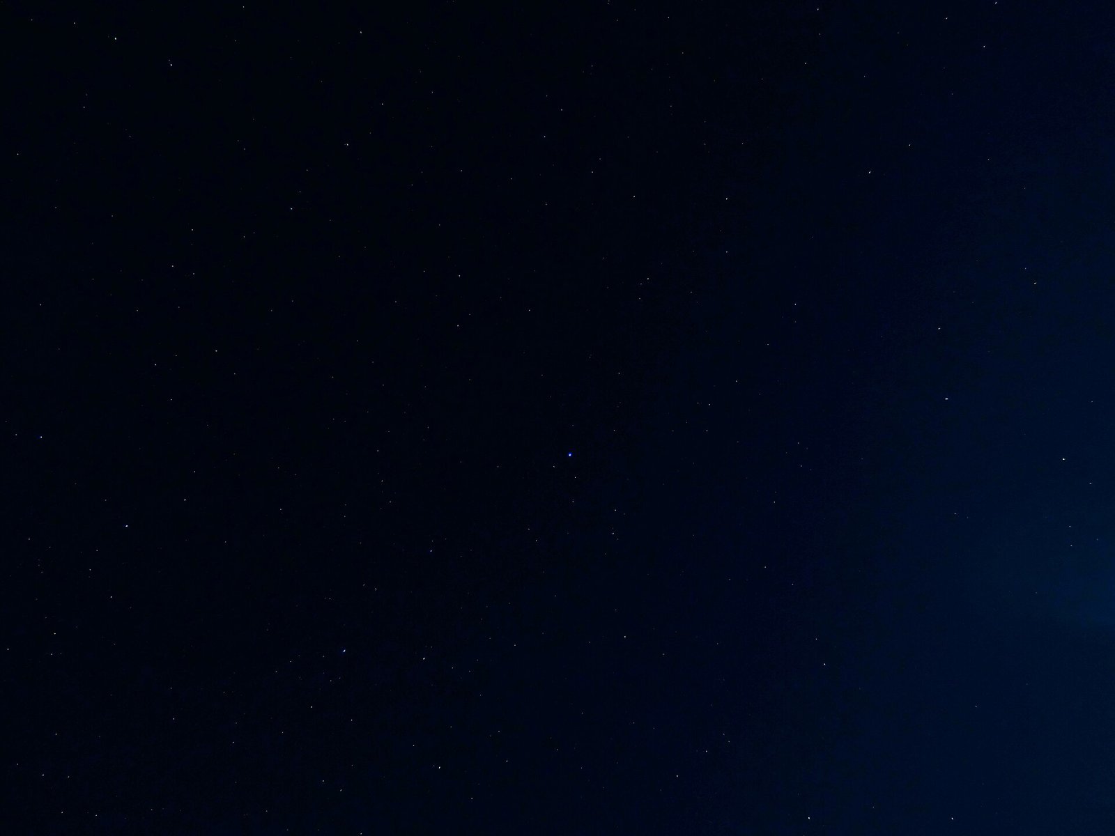 A dark night sky filled with stars