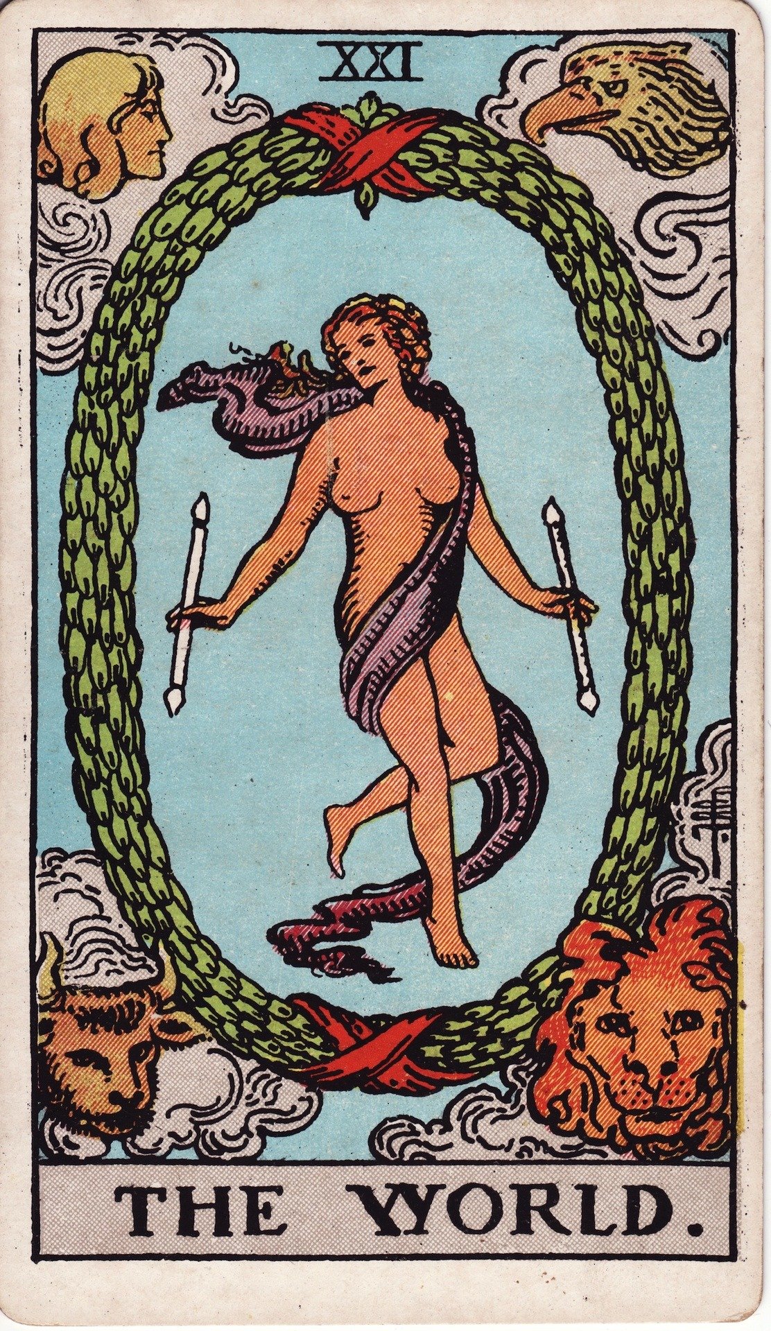 The World card from the Rider-Waite tarot deck, showing a dancing figure inside a laurel wreath.