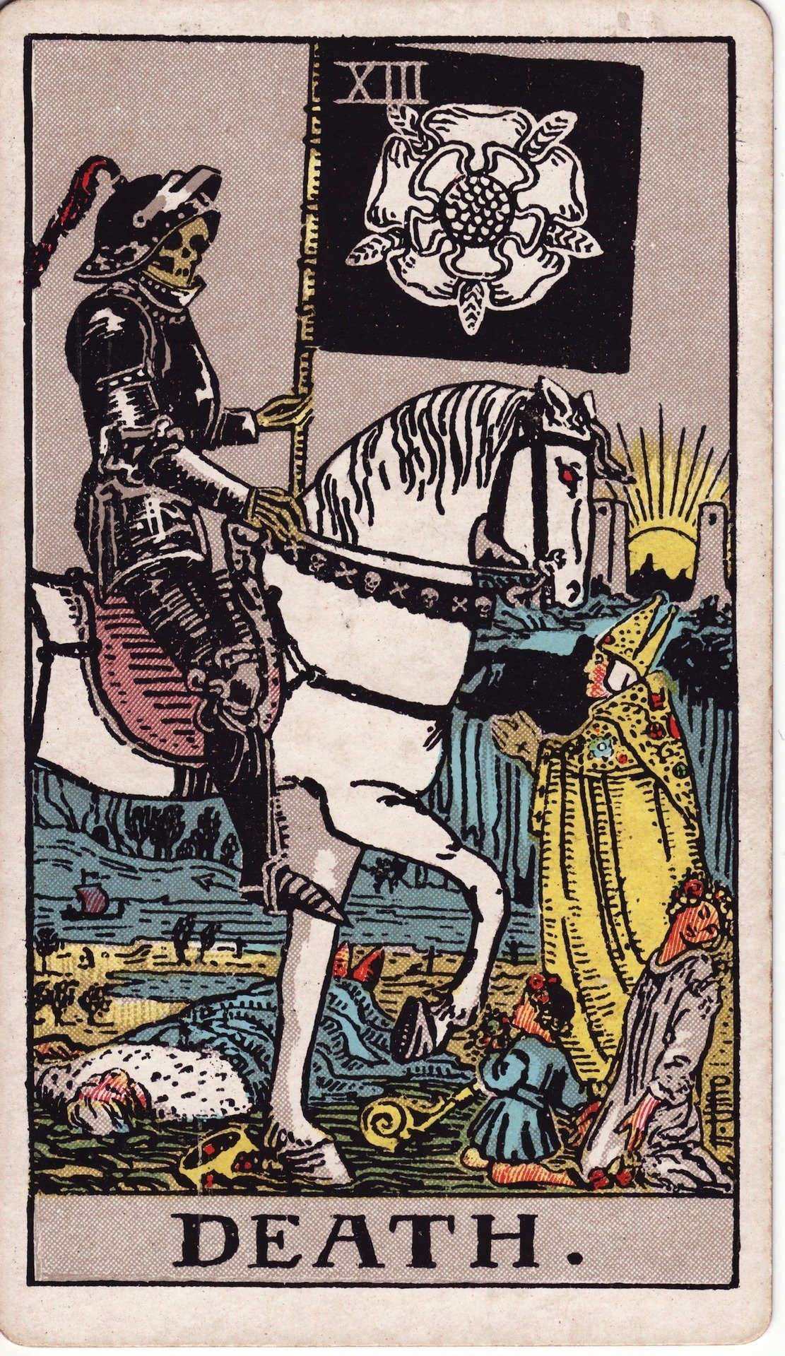 The Death card from the Rider-Waite tarot deck, showing a skeletal rider on a white horse.