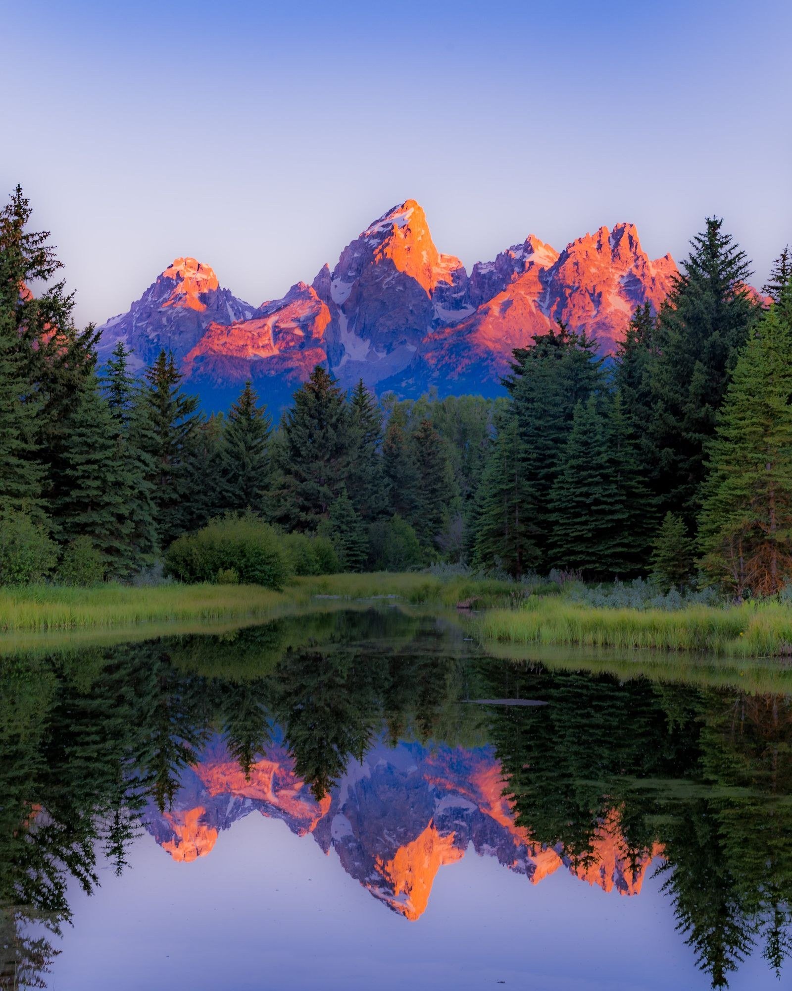Mount Hood reflected in the still water of Mirror Lake, Oregon.