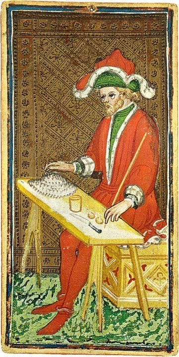 The Magician card from the mid-15th-century Visconti-Sforza tarot, a hand-painted miniature showing a seated man in red robes and a red-and-white hat working at a table with small implements, against a gold-patterned background.