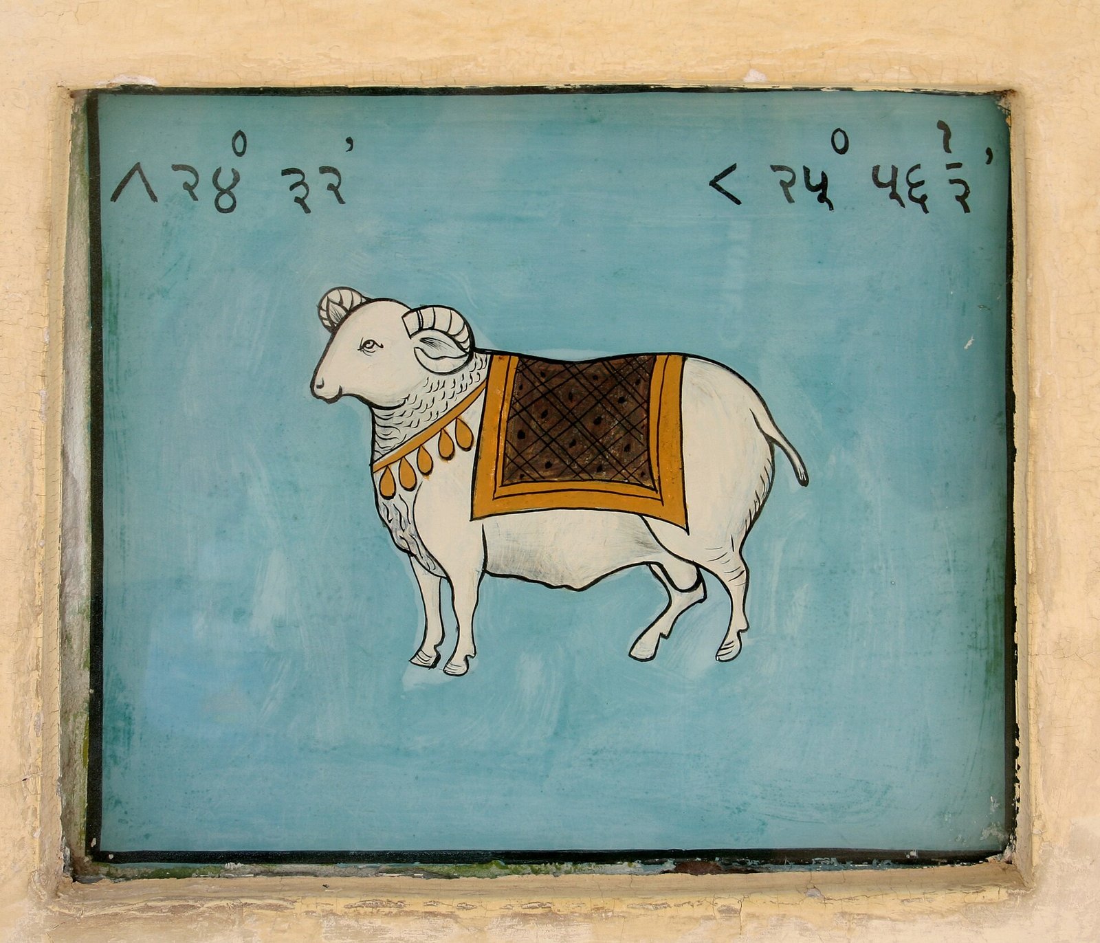 A painted fresco of a white ram, the symbol of Aries, on a wall at the Jantar Mantar observatory in Jaipur, India.