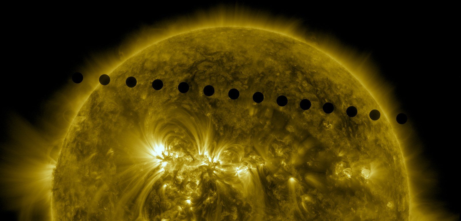 A sequence of solar telescope images showing the planet Venus as black dots crossing the face of the Sun during the 2012 transit
