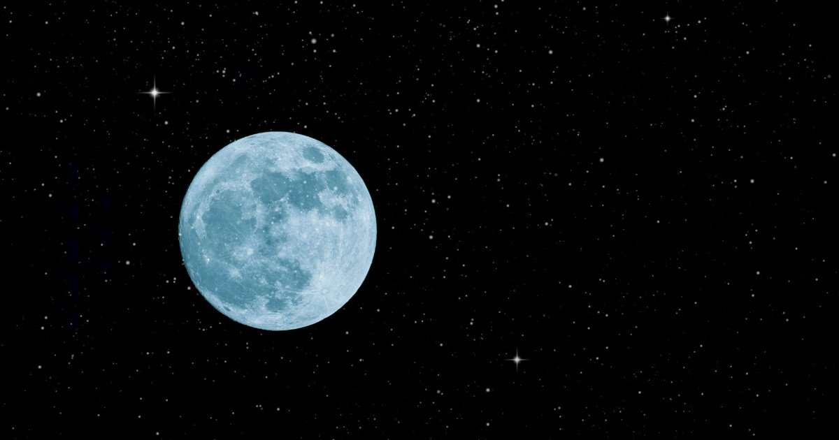 Full moon glowing in a clear dark night sky