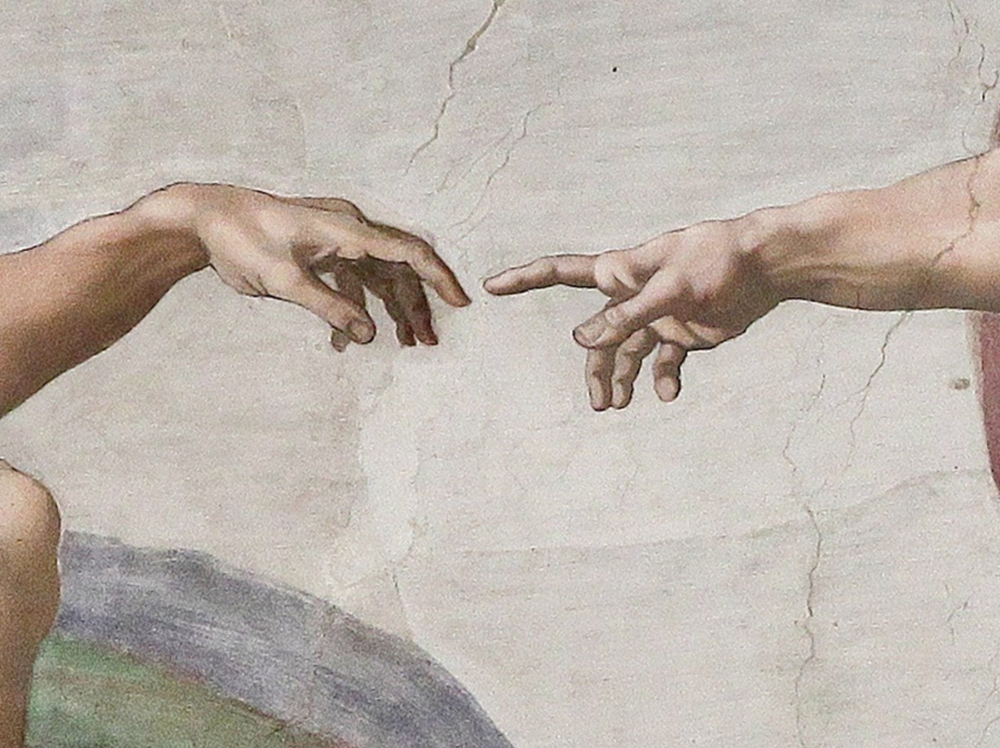 Detail from Michelangelo's Creation of Adam fresco on the Sistine Chapel ceiling, showing the nearly touching outstretched hands of God and Adam.